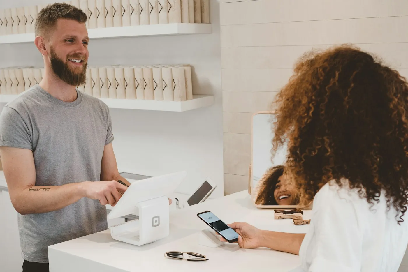 Retail customer completing a purchase at a point of sale